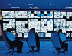  ??  ?? A police CCTV control room, above, part of a raft of new technology, including biometric identifica­tion, that Ms Dick says must form a part of modern policing