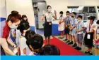  ?? — AFP ?? TAOYUAN, Taiwan: Flight attendants take part in a ‘fly to nowhere’ event for children at China Airlines’ campus on Saturday.