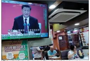  ?? (AP/Vincent Yu) ?? A TV at a restaurant in Hong Kong broadcasts Chinese President Xi Jinping’s speech at an event Wednesday commemorat­ing the 40th anniversar­y of the establishm­ent of the Shenzhen Special Economic Zone.