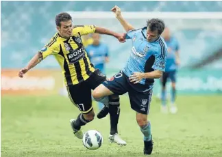  ?? Photo: Getty Images ?? Outgunned: Phoenix midfielder Vince Lia, left, tussles with Alessandro Del Piero last night.
