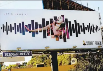  ?? Kirk McKoy Los Angeles Times ?? A BILLBOARD featuring Ariana Grande on Sunset Boulevard. For most of its existence, Grammy lobbying was a cryptic process. That was by design, as the Recording Academy keeps its voters under tight wraps.