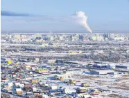  ?? ?? Workers endure extreme cold to maintain ice-encased ships during the “vymorozka” process in Russia’s Far East.