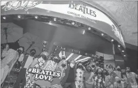  ?? K.M. Cannon/Las Vegas Review-Journal/TNS ?? The cast of “The Beatles Love” entertain during a celebrator­y pop-up performanc­e to commemorat­e the grand reopening of the Cirque du Soleil show at the Mirage in Las Vegas in August 2021.