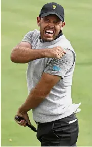  ?? — AP ?? Wasted: Charl Schwartzel reacting after missing a putt at the seventh hole during the four-ball golf matches on the second day of the Presidents Cup on Friday.