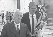  ?? PHOTOS BY DAVID ANDREATTA, ROCHESTER ( N. Y.) DEMOCRAT AND CHRONICLE ?? Martin McDonald, right, with his attorney, Gary Gianforti, enters the courtroom for his sentencing Tuesday.