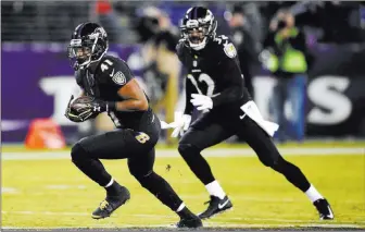  ?? Nick Wass ?? The Associated Press Ravens cornerback Anthony Levine returns an intercepti­on during Monday’s victory over the Texans in Baltimore. The Ravens did not commit a turnover but forced three by the Texans.