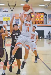  ?? JOHN DENNE/FOR THE NEW MEXICAN ?? ‘With all that stuff going on I’m not sure anyone thought we’d do this,’ said Taos guard Quinn Moon, an All-District 2-4A selection after leading Taos to both the regular season and tournament championsh­ips.