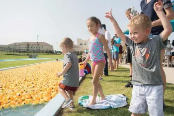  ?? Photo by Tiffany Brown ?? ■ Three-year-old Easton, Stipey, 5, and Beckett, 5, enjoy The Great Texarkana Duck Race in 2018 at Holiday Springs Water Park in this file photo.