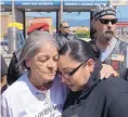  ?? GREG SORBER/JOURNAL ?? Earl Roybal’s aunt, Rita NunezGalle­gos, hugs his daughter, Ashley Roybal, at a news conference Sunday seeking answers to why the man who shot him has not been charged.