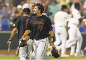  ?? Rebecca S. Gratz / Associated Press ?? Stanford righthande­r Brendan Beck, the Pac12 pitcher of the year, walks off after giving up Vanderbilt’s winning run on his wild pitch in the bottom of the ninth inning in Omaha, Neb.
