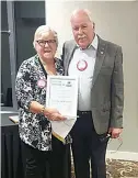  ?? ?? Richard Carlson receives his 20 year Monarch Award from President Erika Wassenberg.