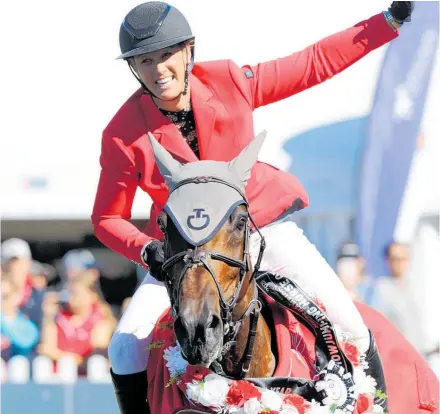  ?? Photo / KAMPIC / Sarah Lord ?? Brooke Edgecombe celebrates the win, riding LT Holst Andrea in the Olympic Cup, Land Rover Horse of the Year 2020.