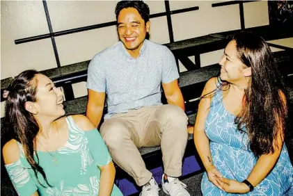  ?? BEA OYSTER FOR THE LOS ANGELES TIMES ?? Singers (from left) Leimomi Kanagusuku, Paul Iona and Rachel Justice in the choir room at Kamehameha Schools — Kapalama Campus in Honolulu. The former members of the school chorus recorded songs for Disney’s 2002 movie “Lilo & Stitch.”