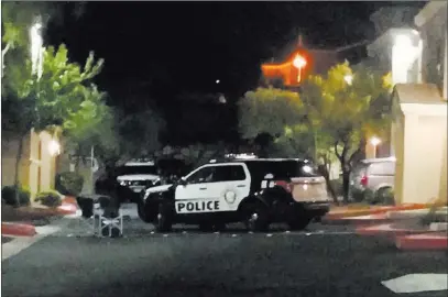  ?? Max Michor ?? Las Vegas police work the scene of a murder-suicide Sunday night in northwest Las Vegas. Las Vegas Review-journal @Maxmichor