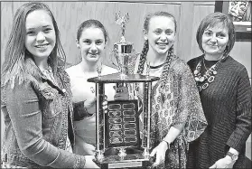  ?? Courtesy photo ?? Lauryn Zeeck (from left), Mary Doke, Rachel Grom, middle school students at St. Vincent de Paul Catholic School in Rogers, and their teacher Sean Grom (right), hold the overall school award from the Northwest Arkansas Regional Science and Engineerin­g...