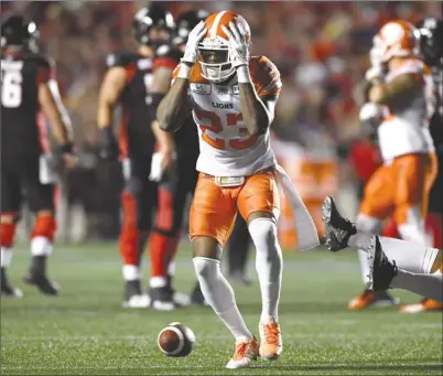  ?? The Canadian Press ?? B.C. Lions defensive back Anthony Thompson (23) reacts after missing an opportunit­y for an intercepti­on during second-half CFL action against the Ottawa Redblacks in Ottawa on Friday night.The Lions lost 29-25.