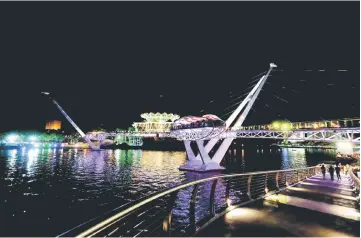  ??  ?? A view of the Darul Hana Bridge after the launch on Saturday evening. — Photo by Kong Jun Liung