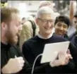  ?? CHARLES REX ARBOGAST - THE ASSOCIATED PRESS ?? Apple CEO Tim Cook smiles as he watches a demonstrat­ion on the new iPad at an Apple educationa­l event at Lane Technical College Prep High School Tuesday in Chicago.