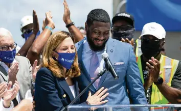  ?? MATIAS J. OCNER mocner@miamiheral­d.com ?? U.S. Rep. Maria Elvira Salazar, left, and Internatio­nal Longshorem­en’s Associatio­n Local 1416 President Torin Ragin at PortMiami on Friday. ‘No other industry is being held back by the federal government like the cruise line industry. Cruise lines should be allowed to operate if they have proper safety protocols in place,’ Salazar said.