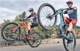  ?? KYLE LEDEBOER COURTESY OF NINER BIKES ?? Syd Schulz, left, and Franklin have been traveling together as profession­al mountain bikers for the past six years but have had their season shut down indefinite­ly due to the novel coronaviru­s.