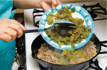  ?? New Mexican ?? Liddie Martinez cooks Enchiladas Compuestas in her home in the Española Valley, all photos Luke E. Montavon/The