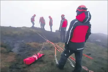  ?? (Pic: SEMRA) ?? SEMRA in action on Monday, with a technical rope rescue of three walkers cragfast between Galtymore and Galtybeg.