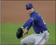  ?? TONY GUTIERREZ - THE ASSOCIATED PRESS ?? FILE - In this July 9, 2020, file photo, Texas Rangers pitcher Corey Kluber throws during an intrasquad game in Arlington, Texas.