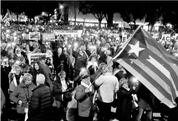  ??  ?? People protest against the Supreme Court at Catalunya Square in Barcelona, Spain. — Reuters photo