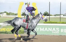  ?? (Photo: Garfield Robinson) ?? under Robert Halledeen, easily wins the $1-million Vassell “Jolly Man” Najair Memorial Cup feature at Caymanas Park yesterday.