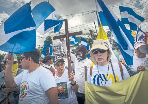  ?? DANIELE VOLPE PHOTOS/THE NEW YORK TIMES ?? Nicaraguan­s at a rally in Managua in support of the Roman Catholic Church, which has been accused of supporting the opposition to President Daniel Ortega.