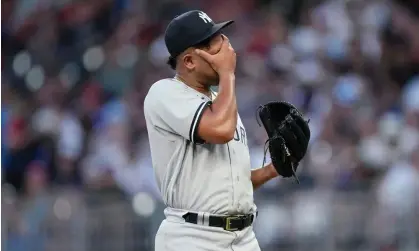  ?? Photograph: John Bazemore/AP ?? New York Yankees pitcher Randy Vasquez wipes his face as he waits for manager Aaron Boone to remove him from the game earlier this month.