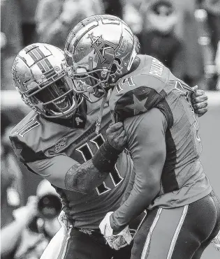  ?? Jon Shapley / Staff photograph­er ?? Roughnecks quarterbac­k P.J. Walker, left, hooked up with wide receiver Cam Phillips on 10 receptions for 122 yards and two touchowns. Walker had three touchdown passes on the day.