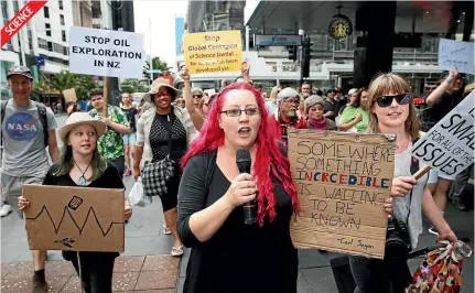  ?? FIONA GOODALL, WARWICK SMITH / FAIRFAX NZ ?? Left, Marchers walk up Queen St in Auckland to show scientific solidarity on an internatio­nal day on of proscience campaignin­g. Below left, protesters march in Auckland to call for legalisati­on of medicinal cannabis. Below right, KFC, Pizza Hut, Carl’s...