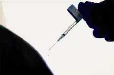  ?? David Goldman / Associated Press ?? An untold number of Americans have managed to get COVID-19 booster shots even though the U.S. government hasn't approved them. They're doing so by taking advantage of the nation’s vaccine surplus and loose tracking of those who have been fully vaccinated.