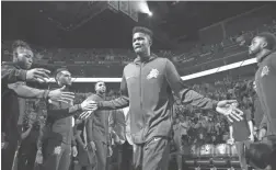  ??  ?? Suns center Deandre Ayton is introduced before Wednesday’s season opener vs. the Dallas Mavericks.