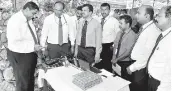  ??  ?? GROUP CEO, LALITH DE SILVA MAKING HIS FIRST CALL FROM DELFT ISLAND AT THE OFFICIAL OPENING CEREMONY. CHIEF REGIONAL OFFICER, CHINTHAKA WIJESOORIY­A, GM - REGION 3, A. KIRUPAKARA­NAN, NAGENDRAMN­AVANEETHAN, DGM-NOTHERN PROVICE AND OTHER SLT REGIONAL...