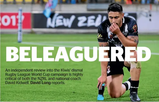  ?? PHOTOS: PHOTOSPORT ?? Kiwis star Shaun Johnson is dejected after the World Cup quarterfin­al loss to Fiji, the low point of a forgettabl­e campaign.
