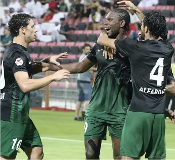 ?? Pawan Singh / The National ?? Makhete Diop, centre, posted a double as Shabab Al Ahli Dubai eventually overcame Hatta in the newly formed team’s first Arabian Gulf League match