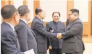  ?? STR, AFP/GETTY IMAGES ?? North Korean leader Kim Jong Un, right, greets members of his delegation, who visited South Korea.