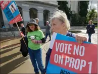  ?? FRED GREAVES FOR CALMATTERS ?? Natalie Conrad and Debi Davis speak out during a “Vote No on Prop. 1” protest on the west steps of the Capitol on Feb. 1.