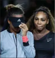  ?? Associated Press ?? Who won?: Naomi Osaka, of Japan, is hugged by Serena Williams after Osaka defeated Williams in the women's final of the U.S. Open Saturday in New York.