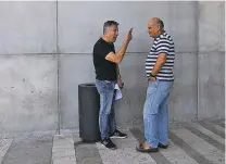  ?? CORINNA KERN/NEW YORK TIMES ?? Zion Cohen, left, speaks with Eli Teretz on Monday in front of a mall in Beit Shemesh, Israel. ‘I know it’s painful to Jews in America how Israel acts toward them. … We need help from the Jews of the U.S., especially given how much anti-Semitism there is now in the world,’ Cohen said.