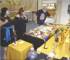  ?? PHOTO COURTESY MIKE NICHOLAS ?? Robert “Bob” Diaz (far right) chats with a visitor about a new exhibition highlighti­ng the elements of a Dia de los Muertos altar at the Autumn Night at the Museum on Friday, October 13, at Pioneers’ Museum in Imperial.