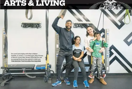  ?? TOM GRALISH/THE PHILADELPH­IA INQUIRER ?? Eric and Carla Hailey with their children Isabella, 13, and E.J., 6, at their gym, Max Fitness in Mount Laurel, New Jersey. Dads like Eric are increasing the time they spend in child care.