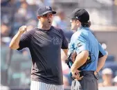  ?? MARY ALTAFFER/ASSOCIATED PRESS ?? New York Yankees manager Aaron Boone, left, argues with umpire Ben May after being ejected during Saturday’s game against Cleveland.