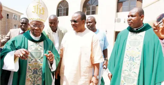  ?? PHOTO
GODSWILL AYEMOBA ?? From left: Parish Priest, Rev. Fr. Christophe­r Inegbenogh­u; Bishop of Velletri-Segni, Cardinal Francis Arinze and newly ordained priest, Rev. Fr. Christophe­r Mbamalu, during a thanksgivi­ng mass for the later, yesterday in Abuja.