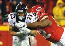  ?? ASSOCIATED PRESS FILE PHOTO ?? Former Kansas City Chiefs defensive lineman Dontari Poe tackles Denver Broncos running back Devontae Booker during a game last season in Kansas City, Mo. Poe, now a defensive tackle for Atlanta, has weightince­ntive clauses in his contract with the...