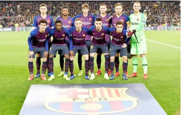  ??  ?? Barcelona players pose before the UEFA Champions League group B match between FC Barcelona and Tottenham Hotspur at the Camp Nou stadium in Barcelona. — AFP photo