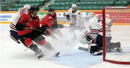  ?? CITIZEN PHOTO BY JAMES DOYLE ?? Matej Toman, left, and Josh Curtis go hard to the net of Kamloops Blazers goaltender Dylan Garand during Sunday afternoon’s WHL game at CN Centre.