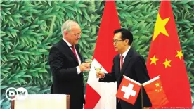  ??  ?? Toasting after a China-Switzerlan­d free trade agreement signing ceremony in Beijing 2013